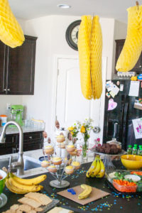 food and decorations at a banana themed first birthday