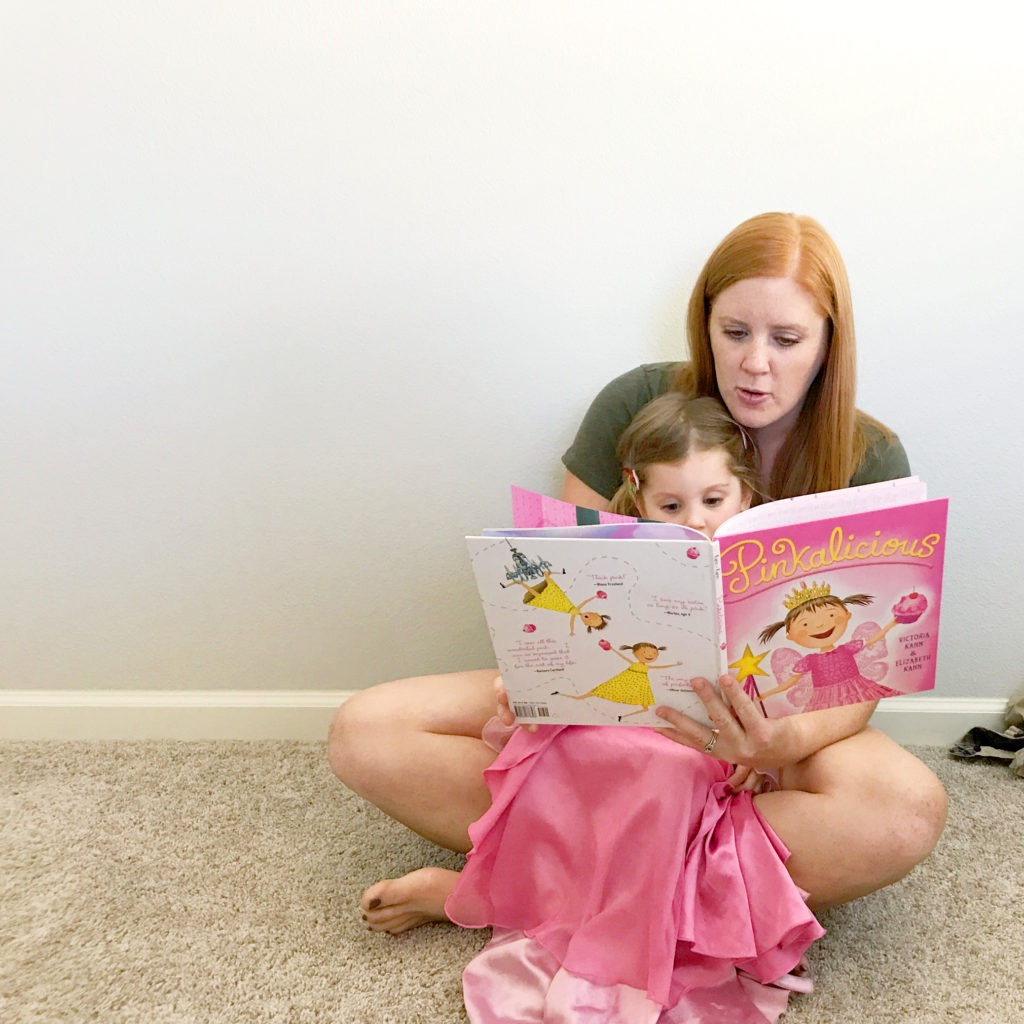 reading a favorite book with my daughter with high functioning autism