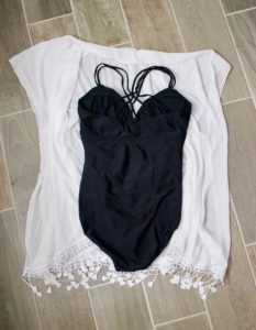 black one piece swimsuit and white coverup