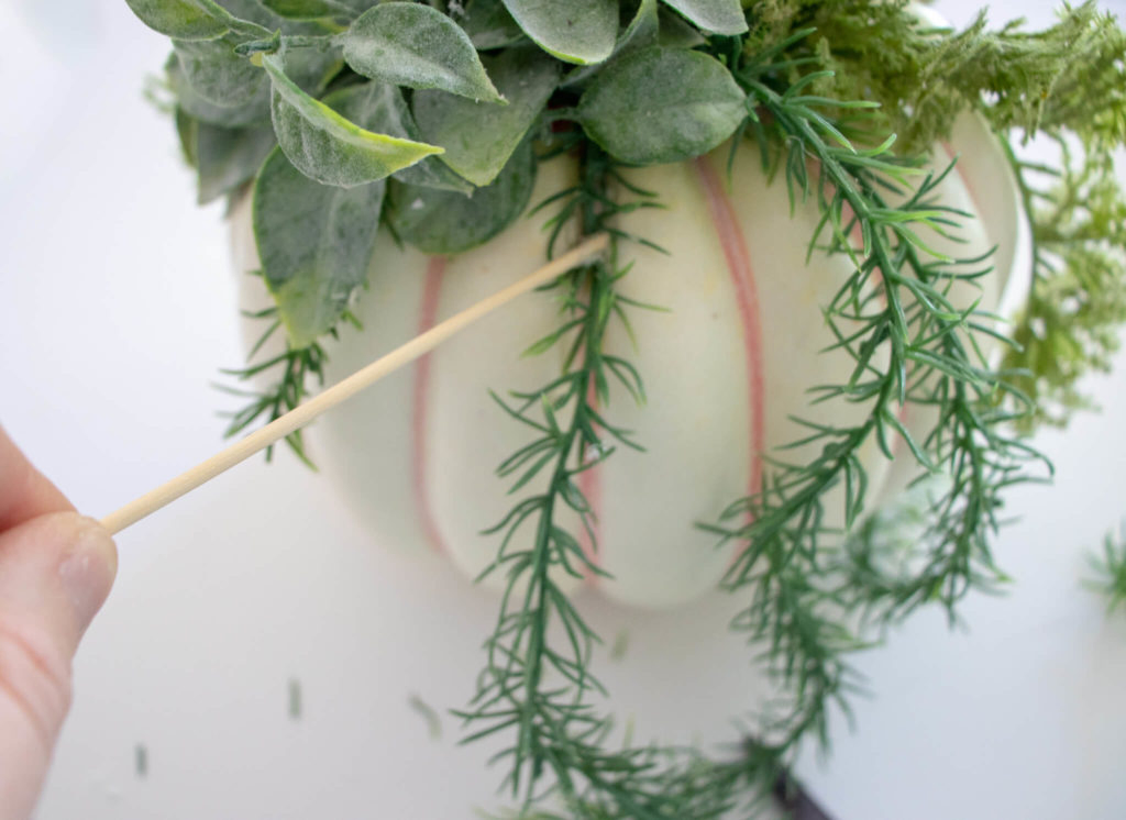 use the wooden skewer to hold the plant in place while the glue dries