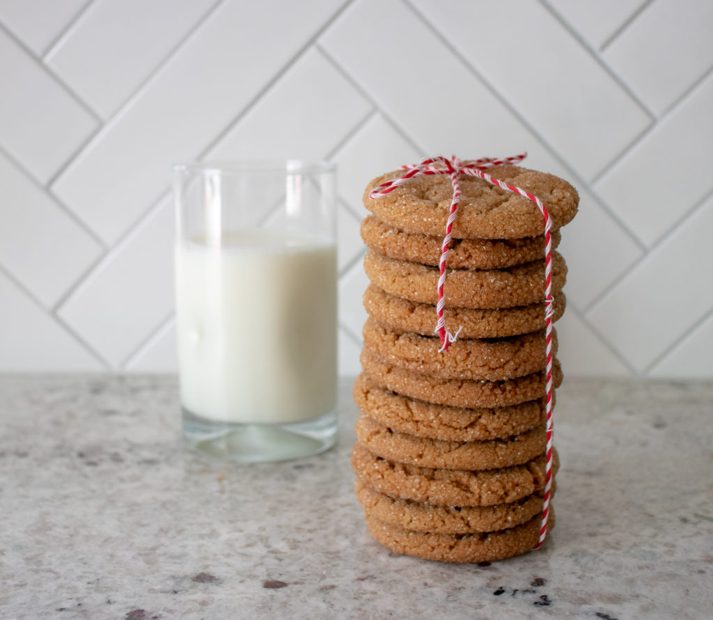 a fresh stack of molasses cookies and a glass of milk