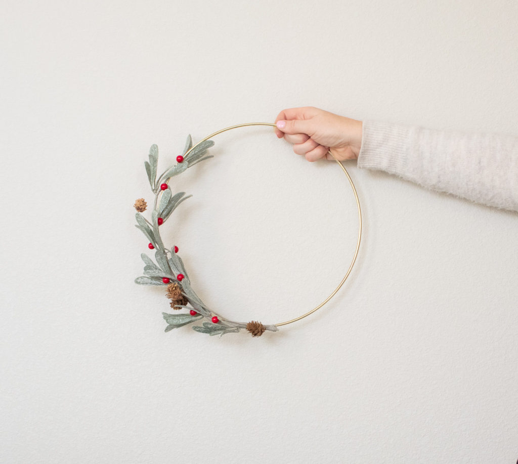 hand holding completed hoop wreath