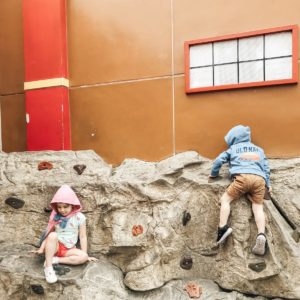 Children climbing a rock wall at Legoland California