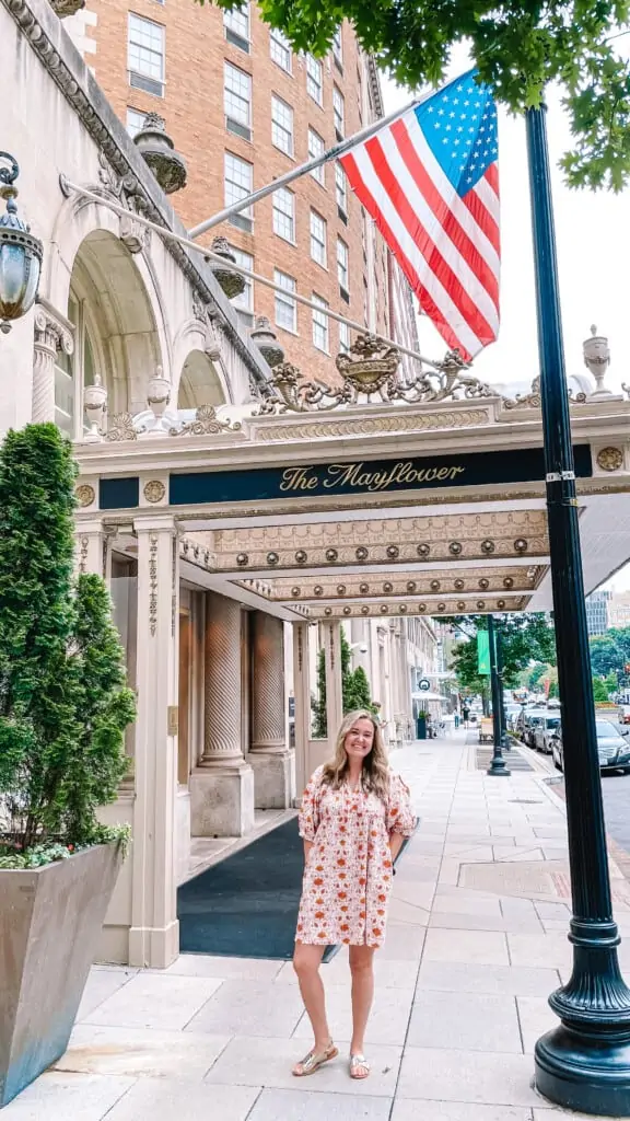 woman in front of mayflower hotel