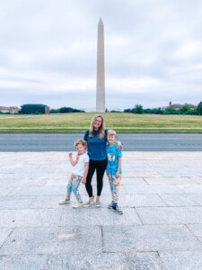 mom and two kids in front of Washington Monument